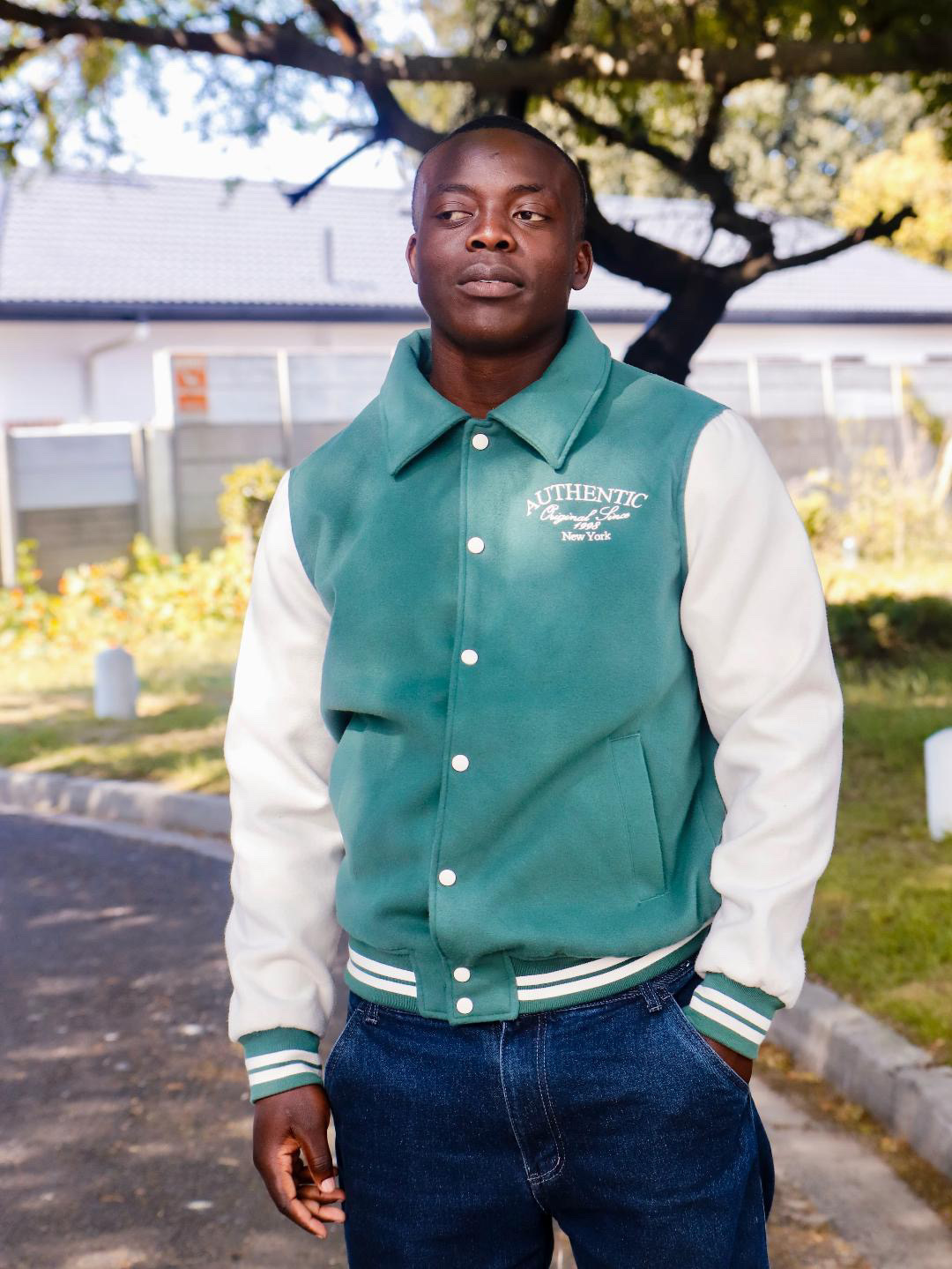 Destiny in a green varsity jacket
