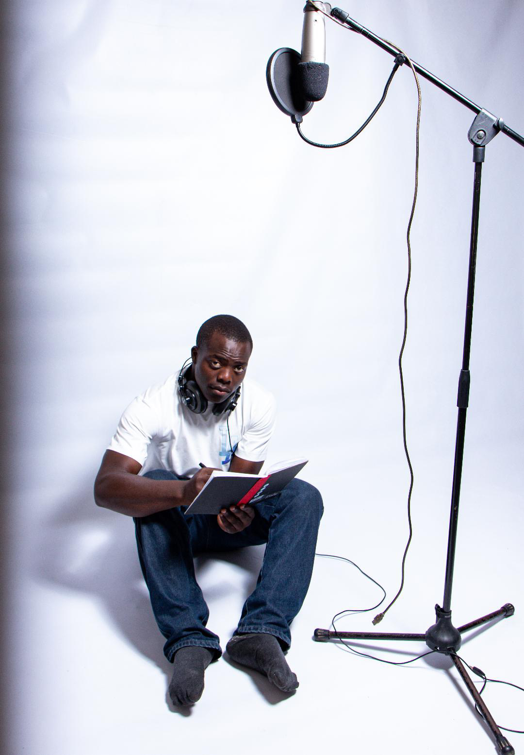 Destiny seated beside a studio mic